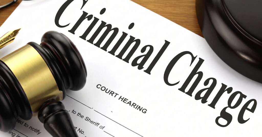 Gavel on criminal charge legal document